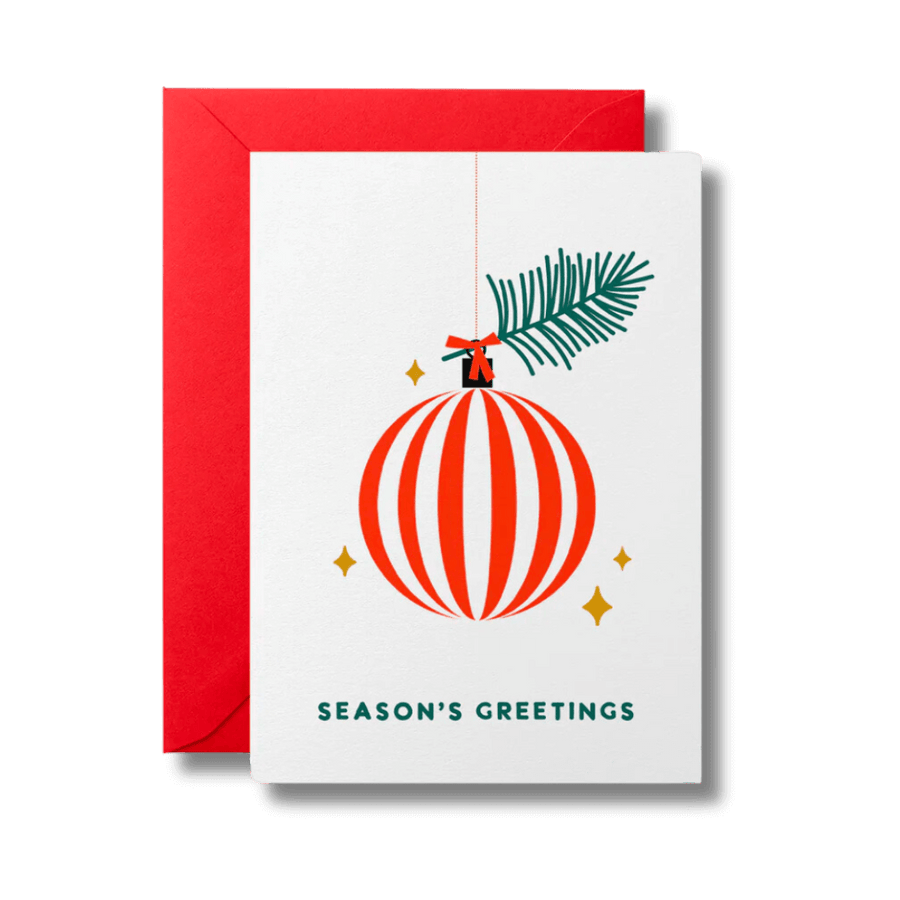 Christmas card reading Season's Greetings below a red and white striped bauble surrounded by gold stars. Card is accompanied by a festive red envelope.