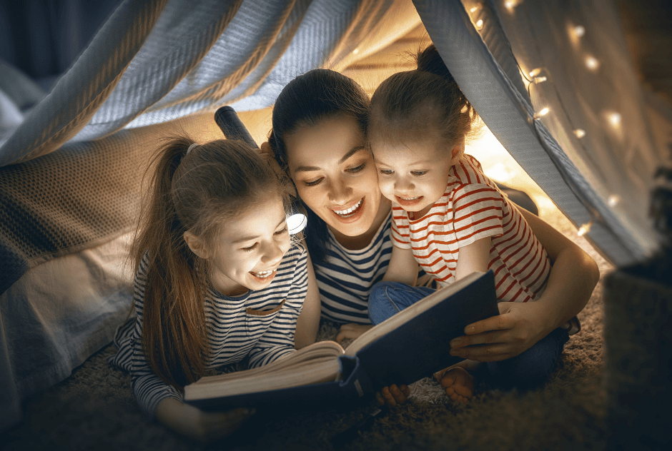 Mother and children reading together.
