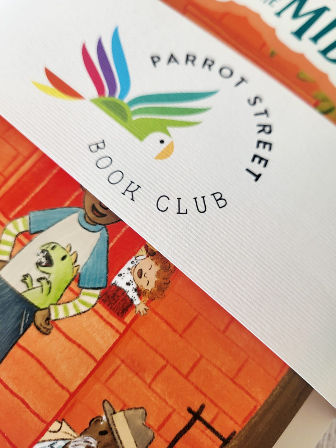 Parrot Street Book Club logo on a book cover with colorful illustrations