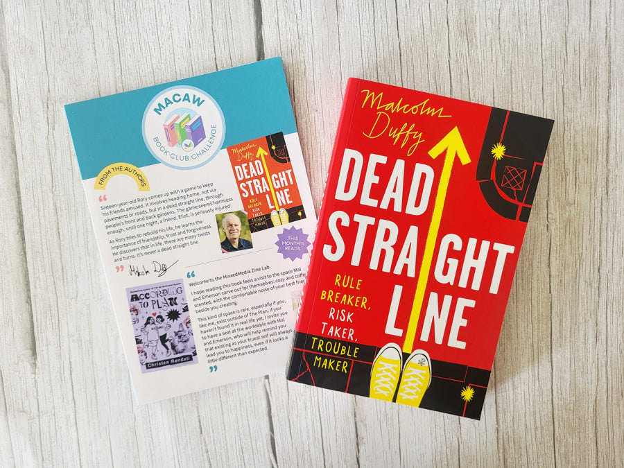 Book titled 'Dead Straight Line' by Malcolm Duffy on a wooden surface with a leaflet.