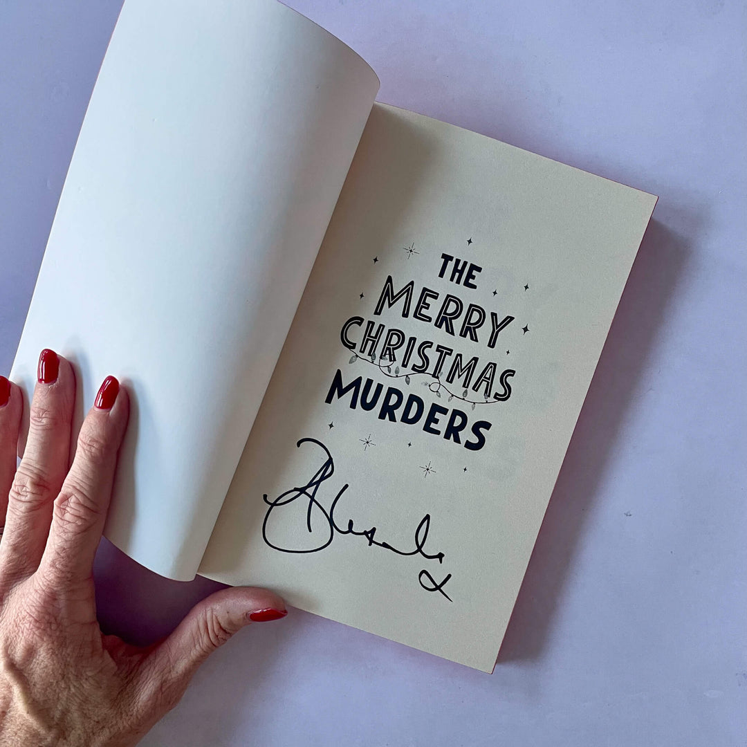Open page of The Merry Christmas Murders showing it signed by the author Alexandra Benedict