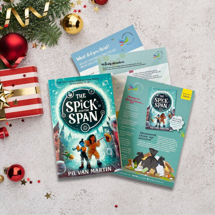 Children's book titled 'The Spick and the Span' by Pil Van Martin with activity pack on a festive background with Christmas decorations.