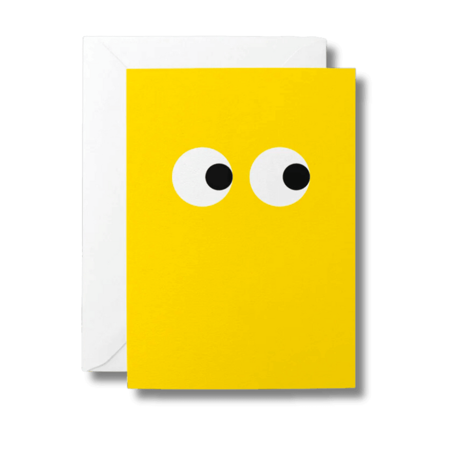 Bright yellow greeting card with large, black and white eyes