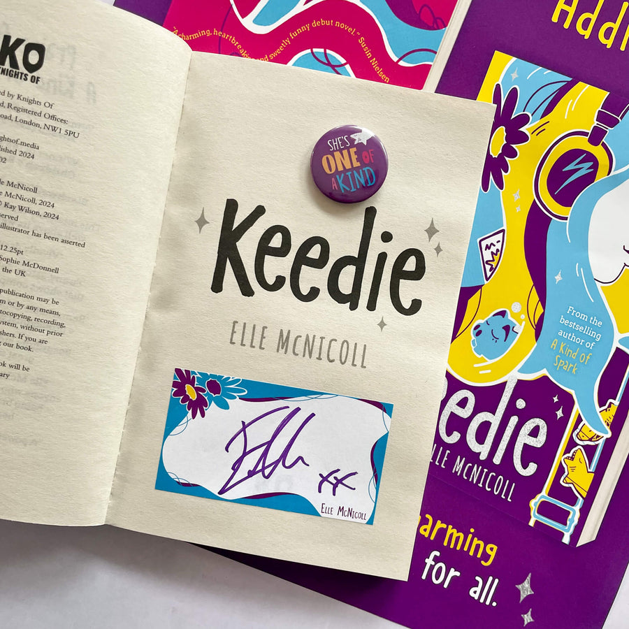 Open copy of Keedie by Elle McNicoll showing a bookplate signed by the author, pin badge and poster