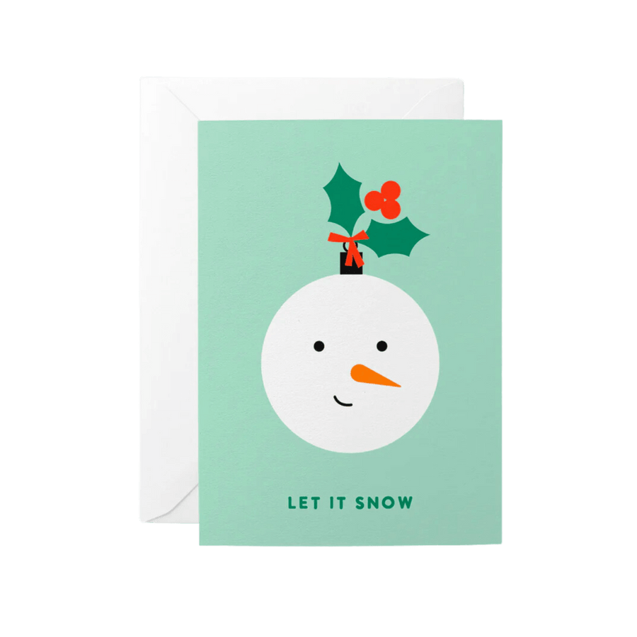 Pale green Christmas card reading Let it Snow. Image of a bauble in the shape of a snowman face.