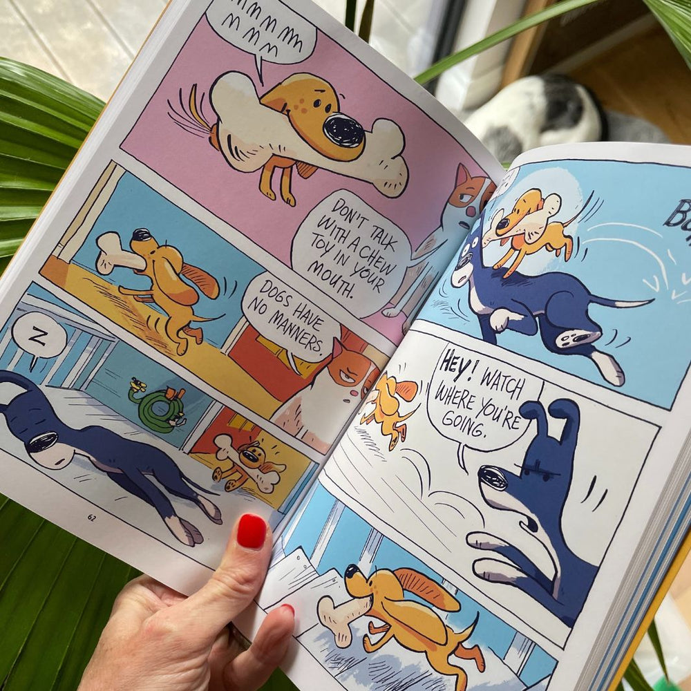 Open copy of Peanut, Butter & Crackers showing the full-colour graphic novel spreads
