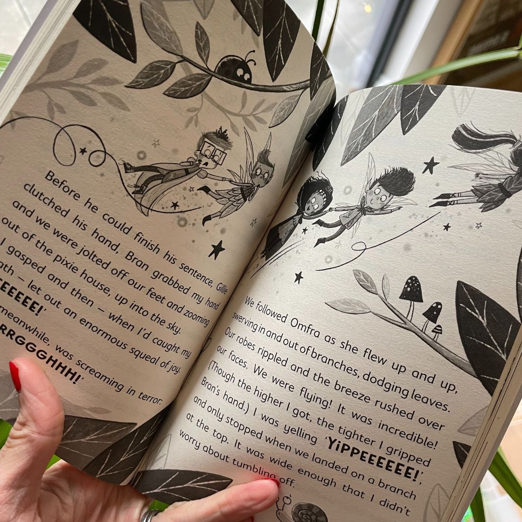 Open copy of Pixies versus Fairies showing the text size and black & white illustrations
