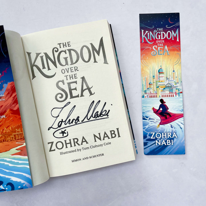 Open copy of The Kingdom Over the Sea signed by Zohra Nabi (author) with accompanying bookmark