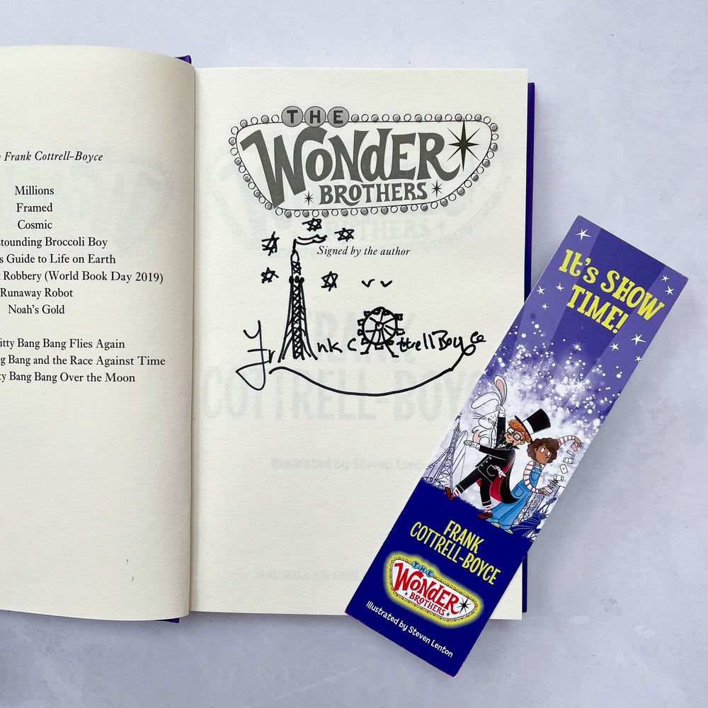 Open copy of The Wonder Brothers by Frank Cottrell-Boyce showing that it's signed by the author, with an accompanying bookmark